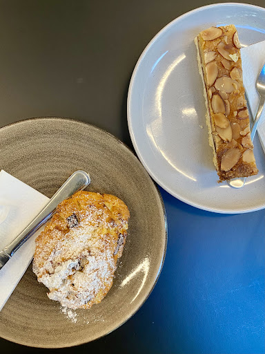 Coffee Mark seating detail with warm wall lighting